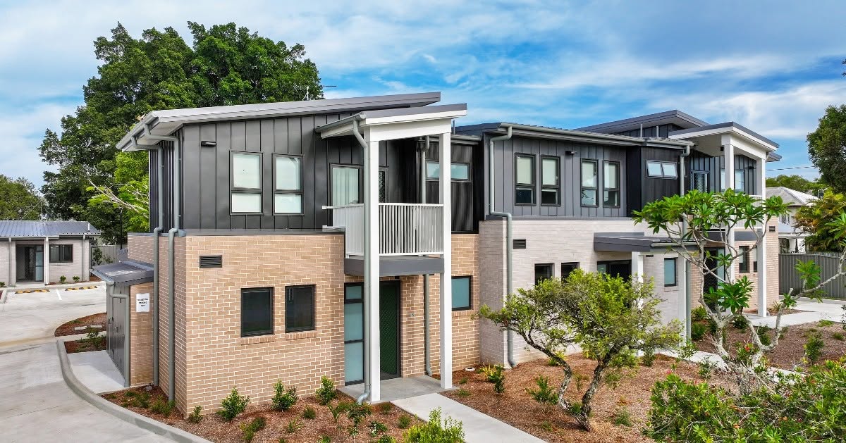 Completed social housing units at Casino with new garden beds and feature trees